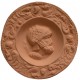 Medalla romano con casco de escamas